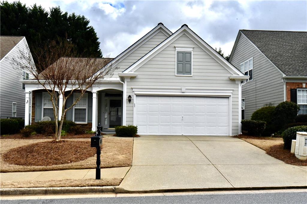 a front view of a house with garage