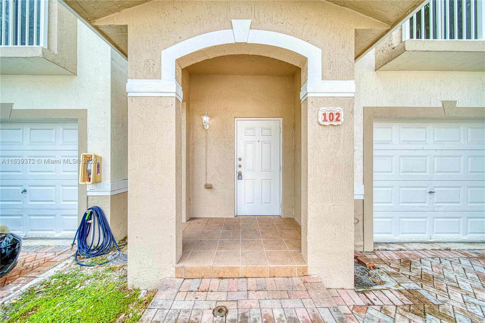 a view of a entryway door front of house