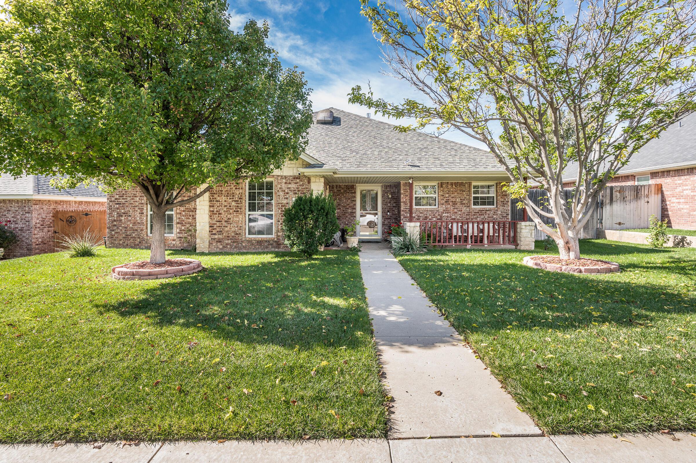 front view of a house with a yard