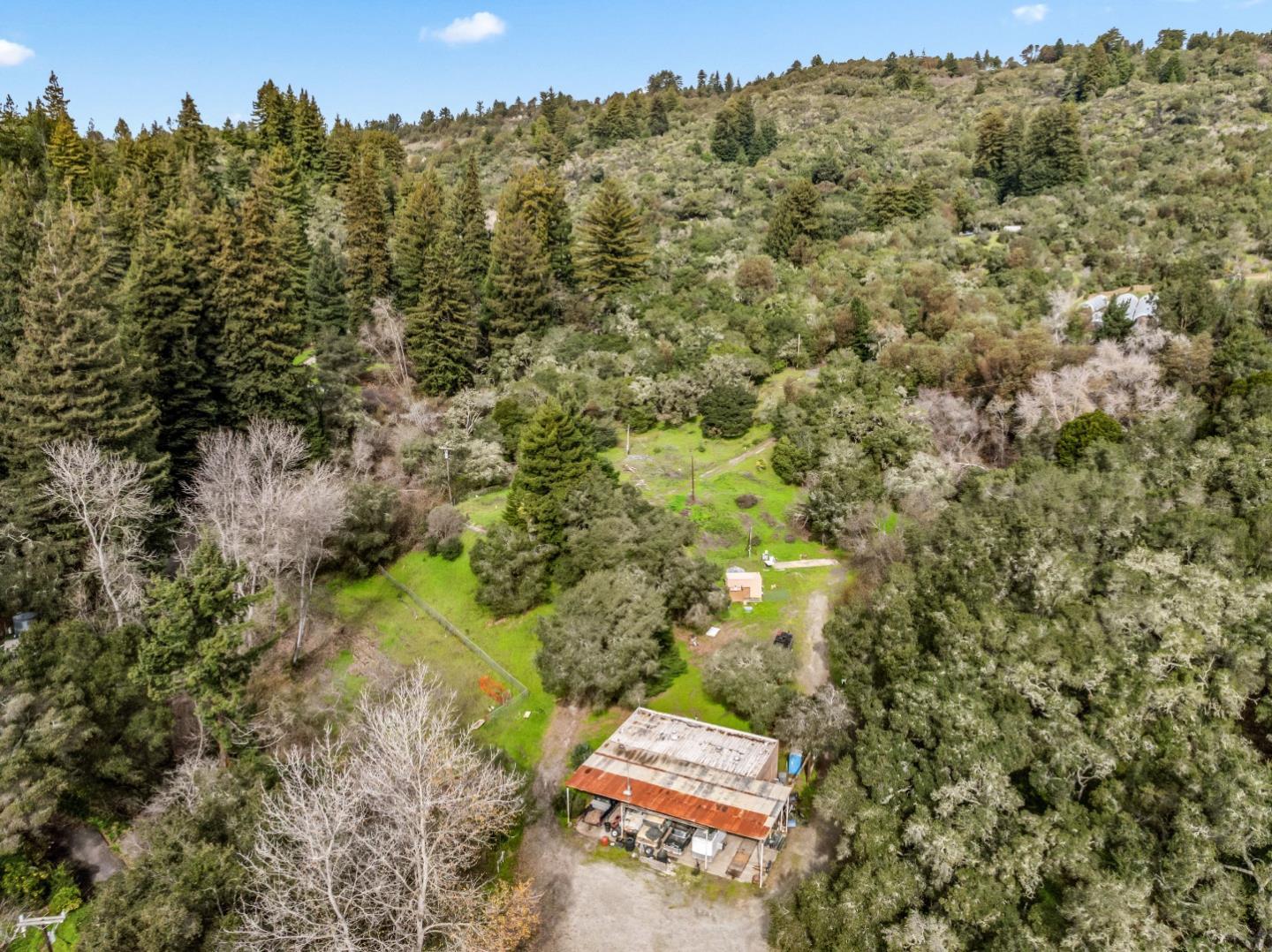 an aerial view of a houses with yard