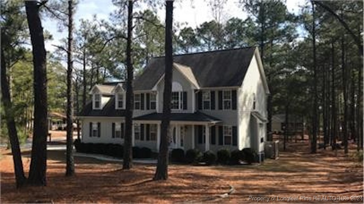 a view of a large house with a yard