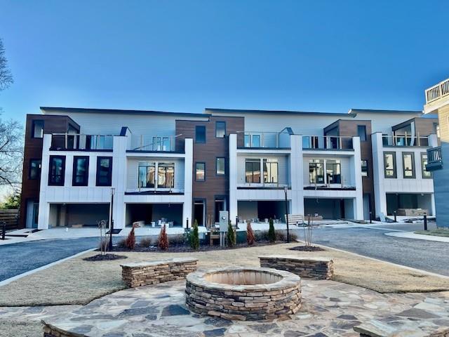 a front view of a brick building with many windows