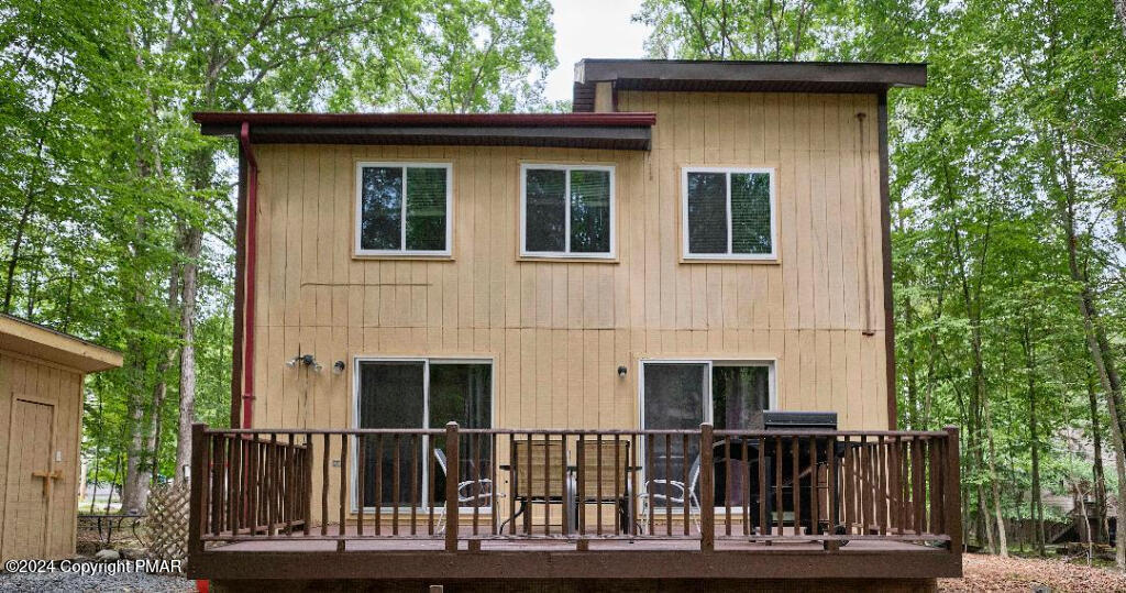 a front view of a house with a fence