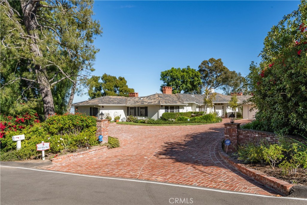 a front view of a house with a yard and a garage