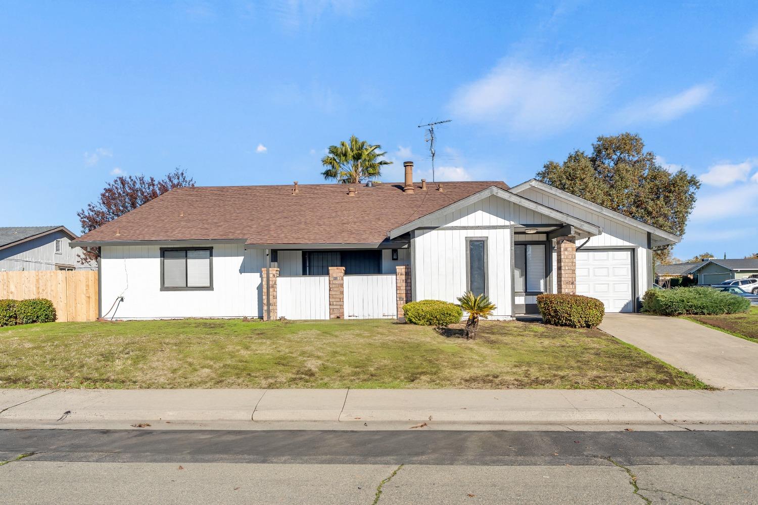 a front view of a house with a yard