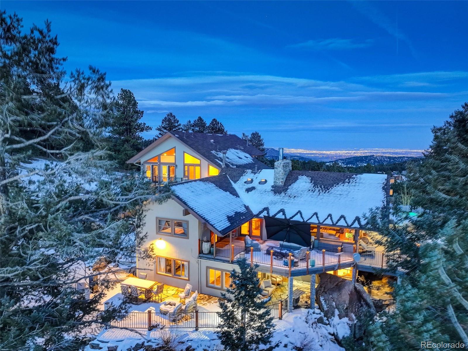 an aerial view of a house with a ocean view