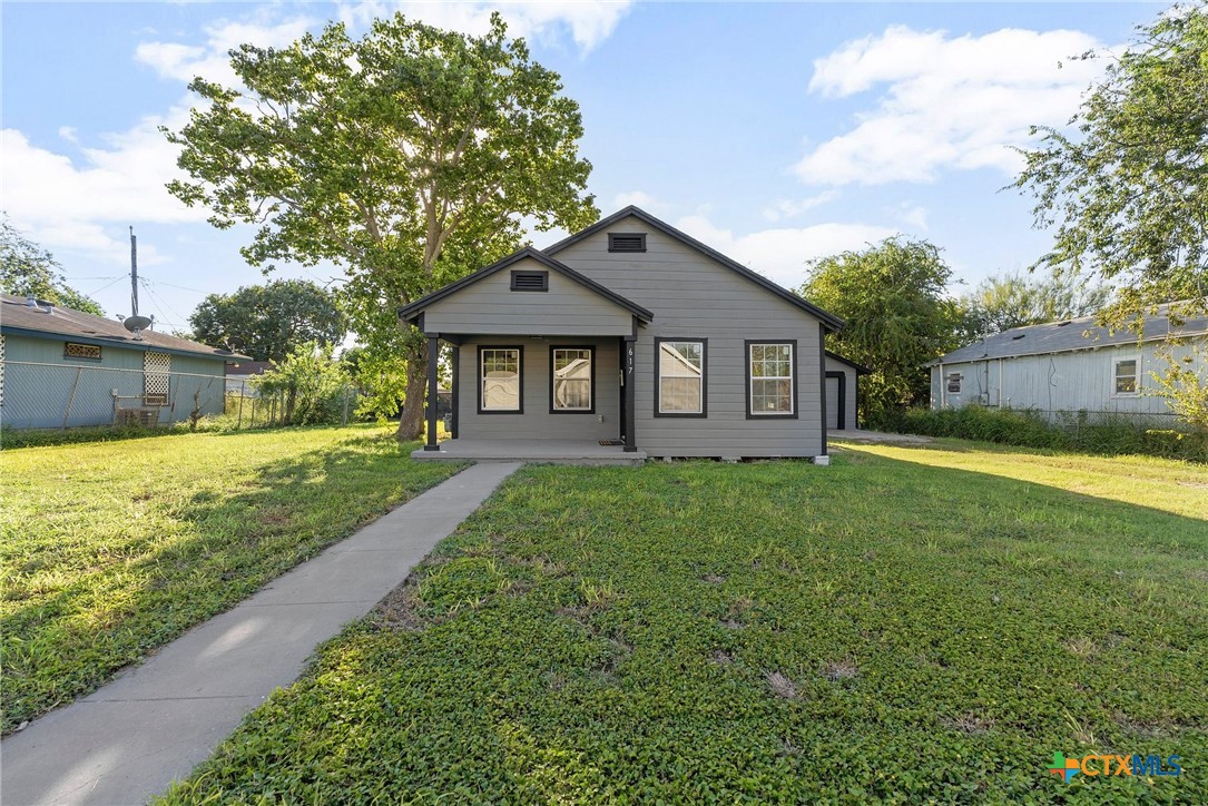 a front view of a house with yard