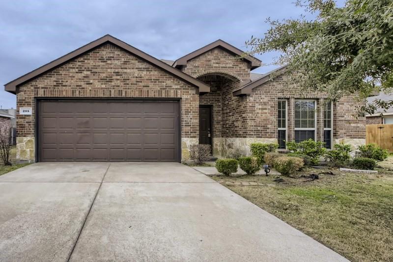 a front view of a house with garage