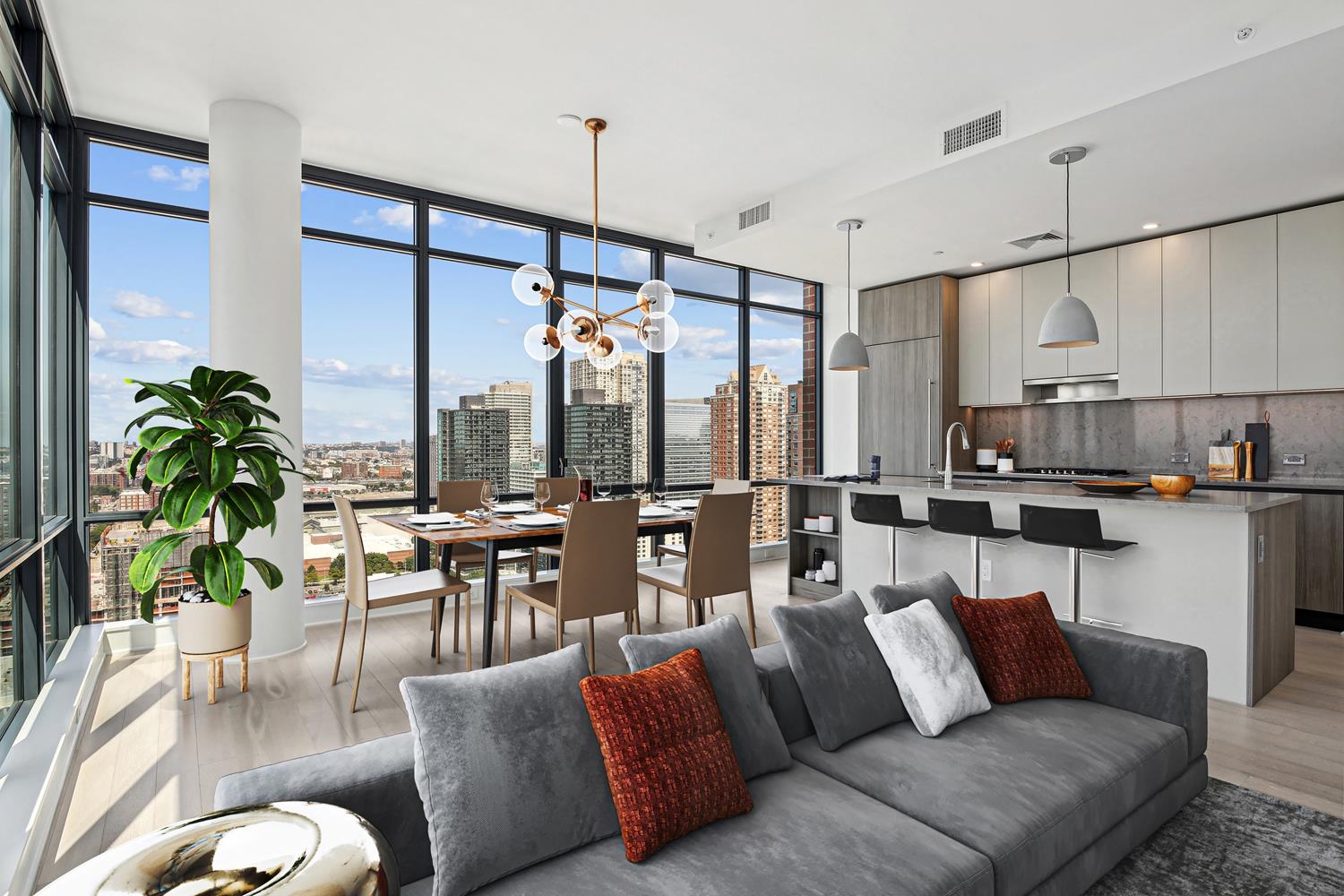 a living room with furniture kitchen view and a large window