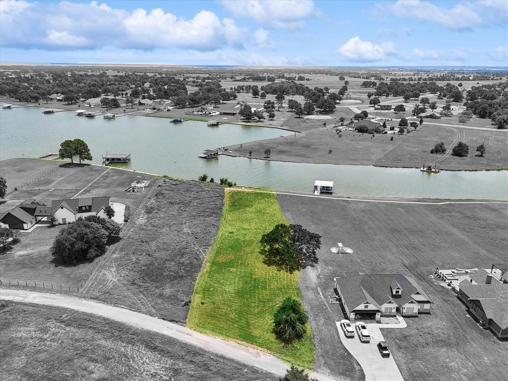 an aerial view of a house with a lake view