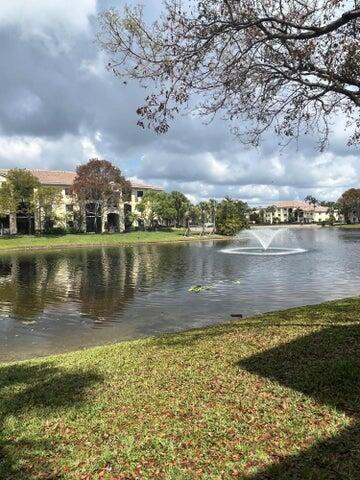 a view of a lake with houses in the back