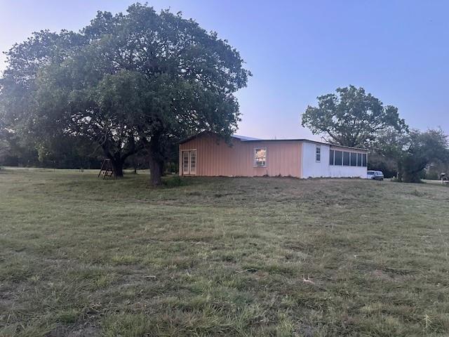 a view of a house with a yard