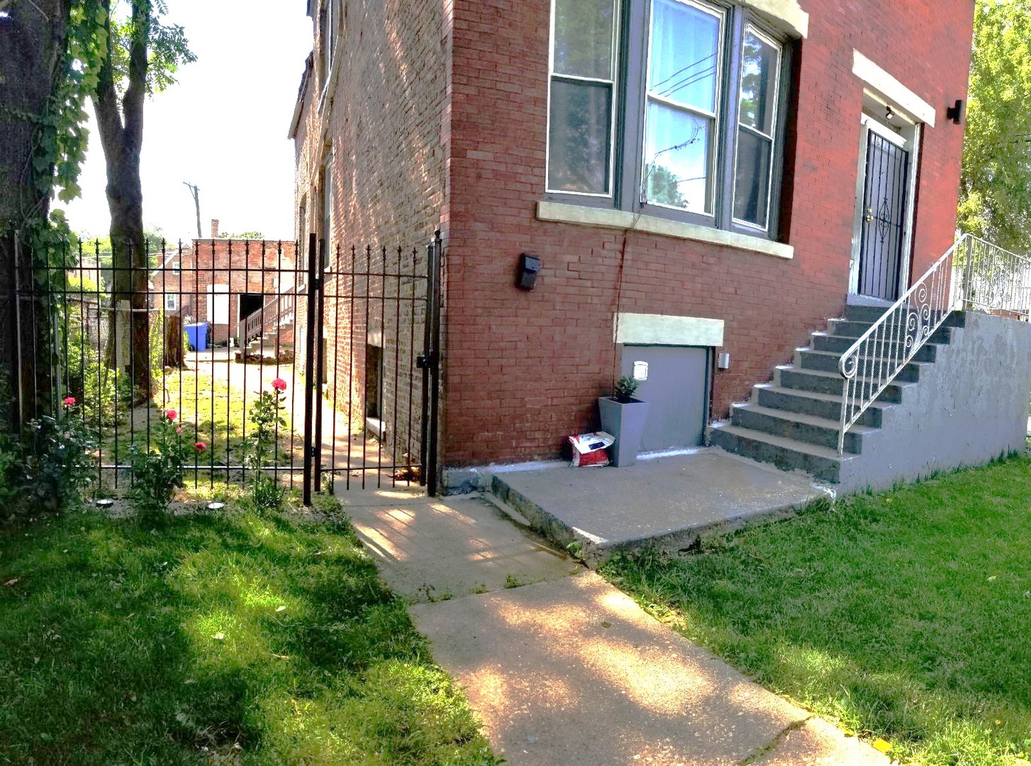 a view of backyard with patio