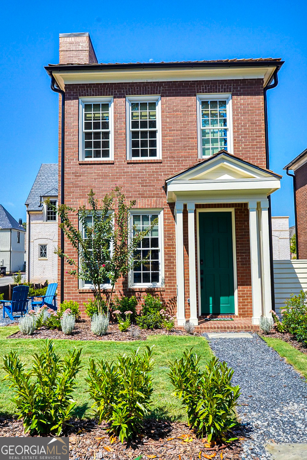 front view of a house with a yard