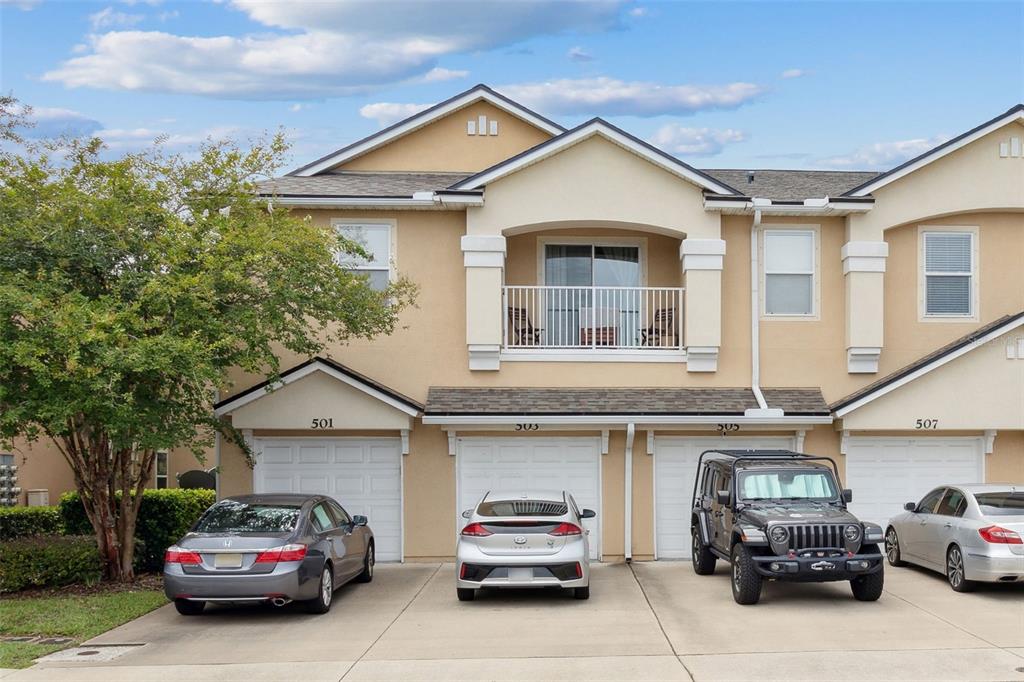 a view of a car parked in front of a house