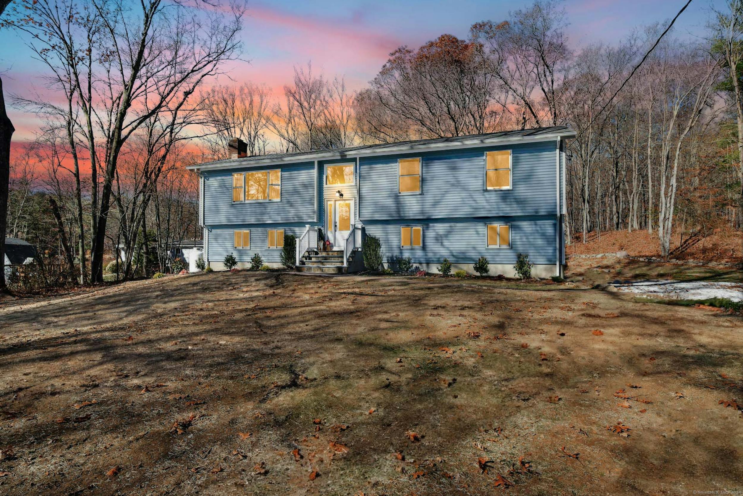 a view of a house with a yard