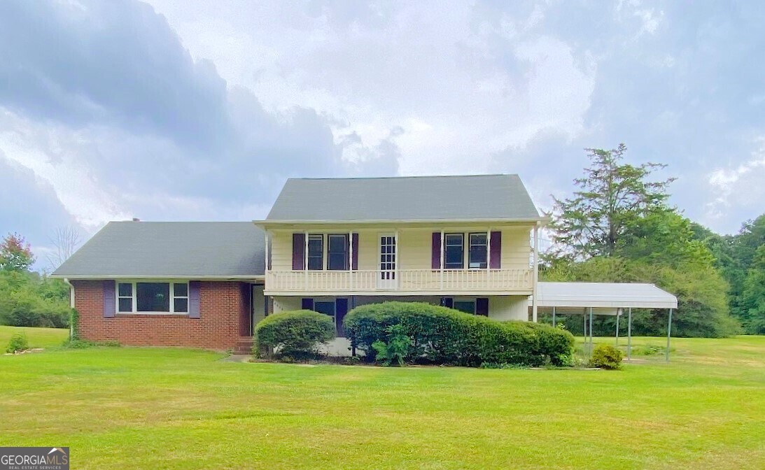 a front view of a house with a yard