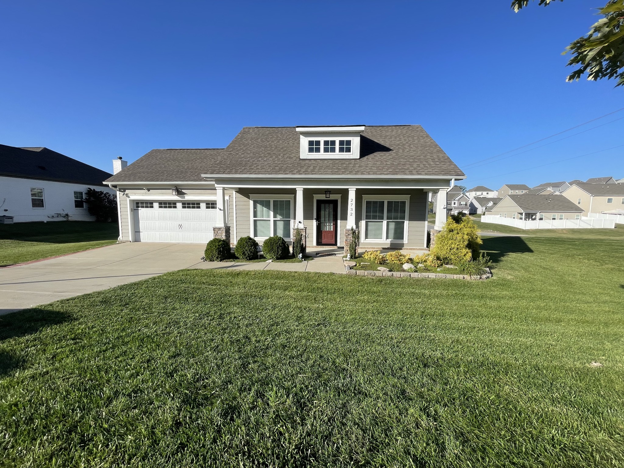 a front view of a house with garden