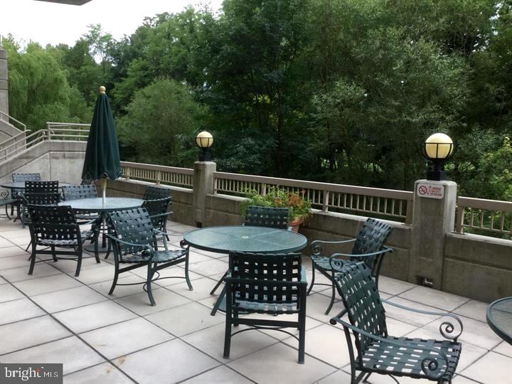 a view of a chairs and table in the patio