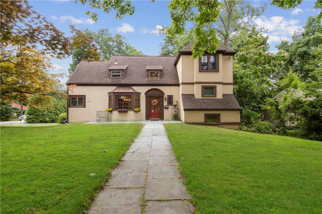 front view of a house with a yard