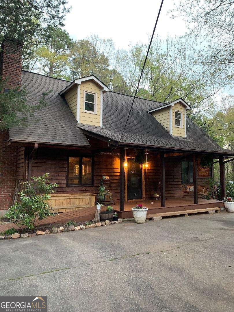 a view of a house with car parked