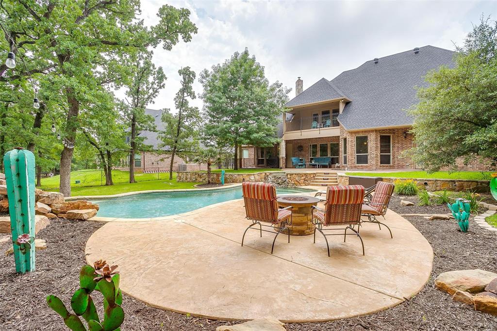 a backyard of a house with outdoor seating