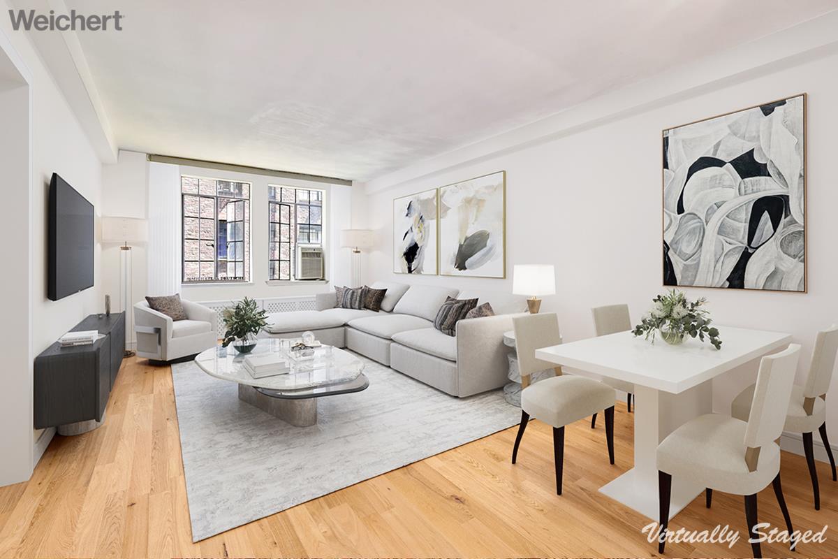 a living room with furniture and flat screen tv