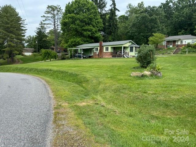 a view of a house with a yard