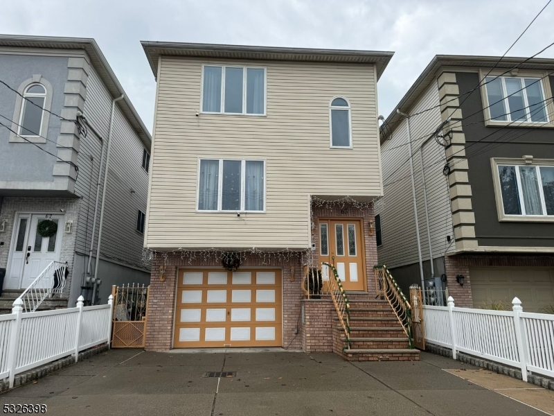 a front view of a house with a garage