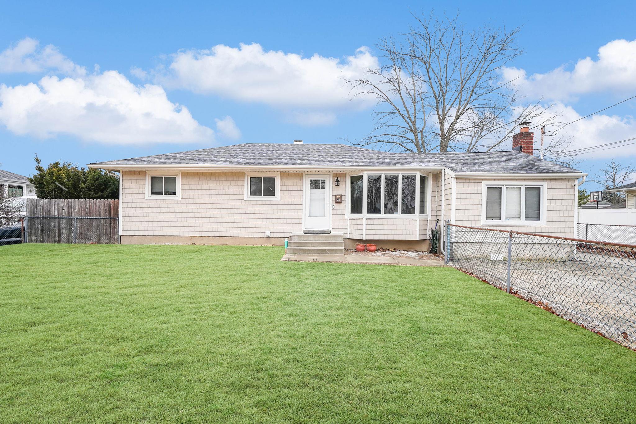 View of front of property with a front yard