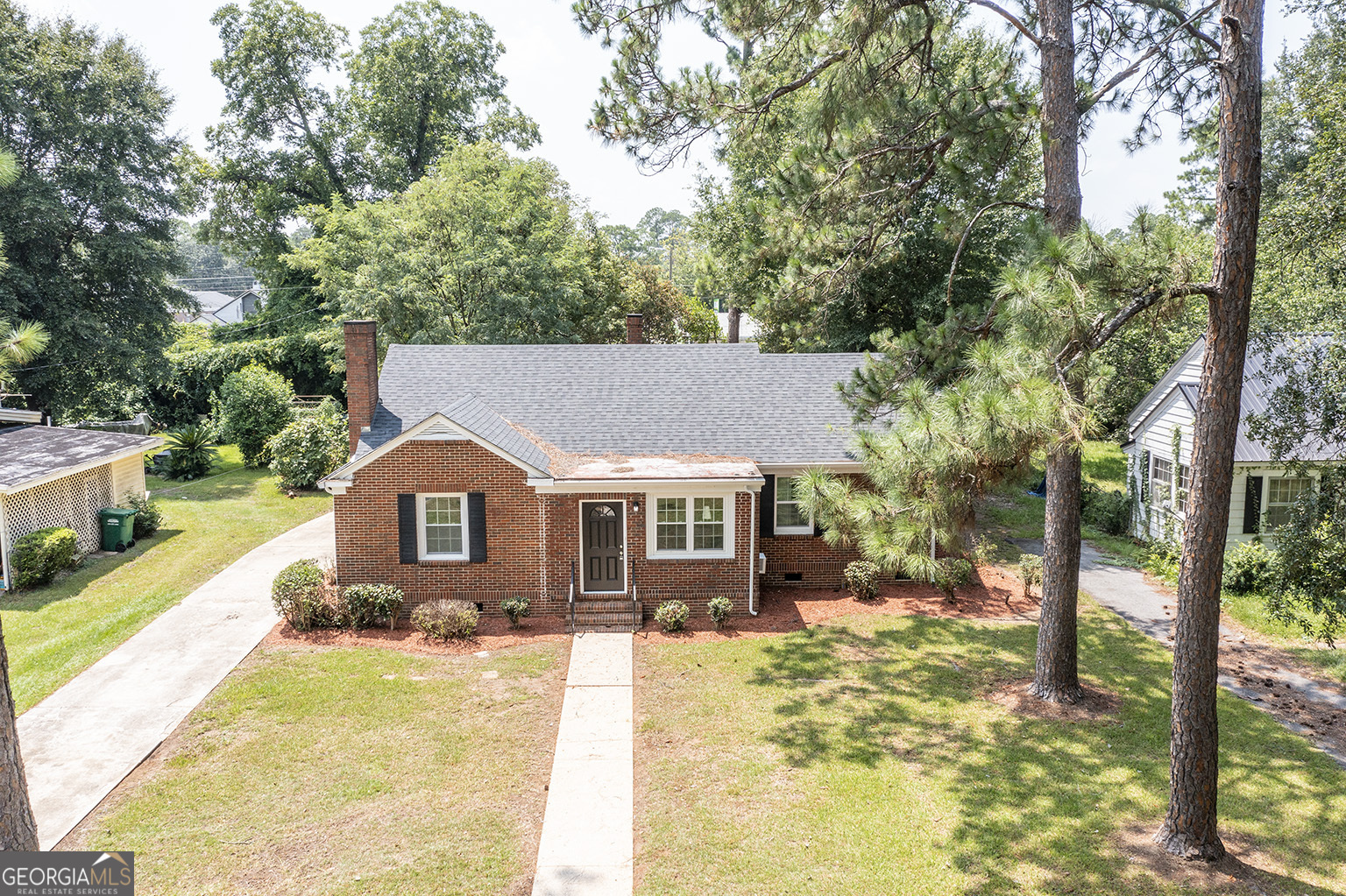 front view of a house with a yard