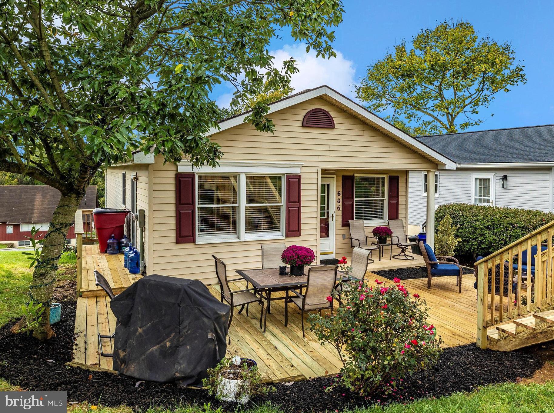 a house view with a sitting space and garden space