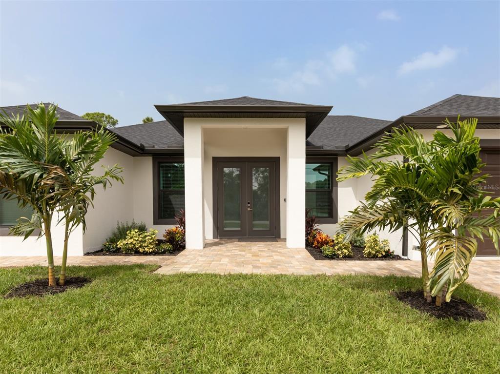 a front view of a house with a yard