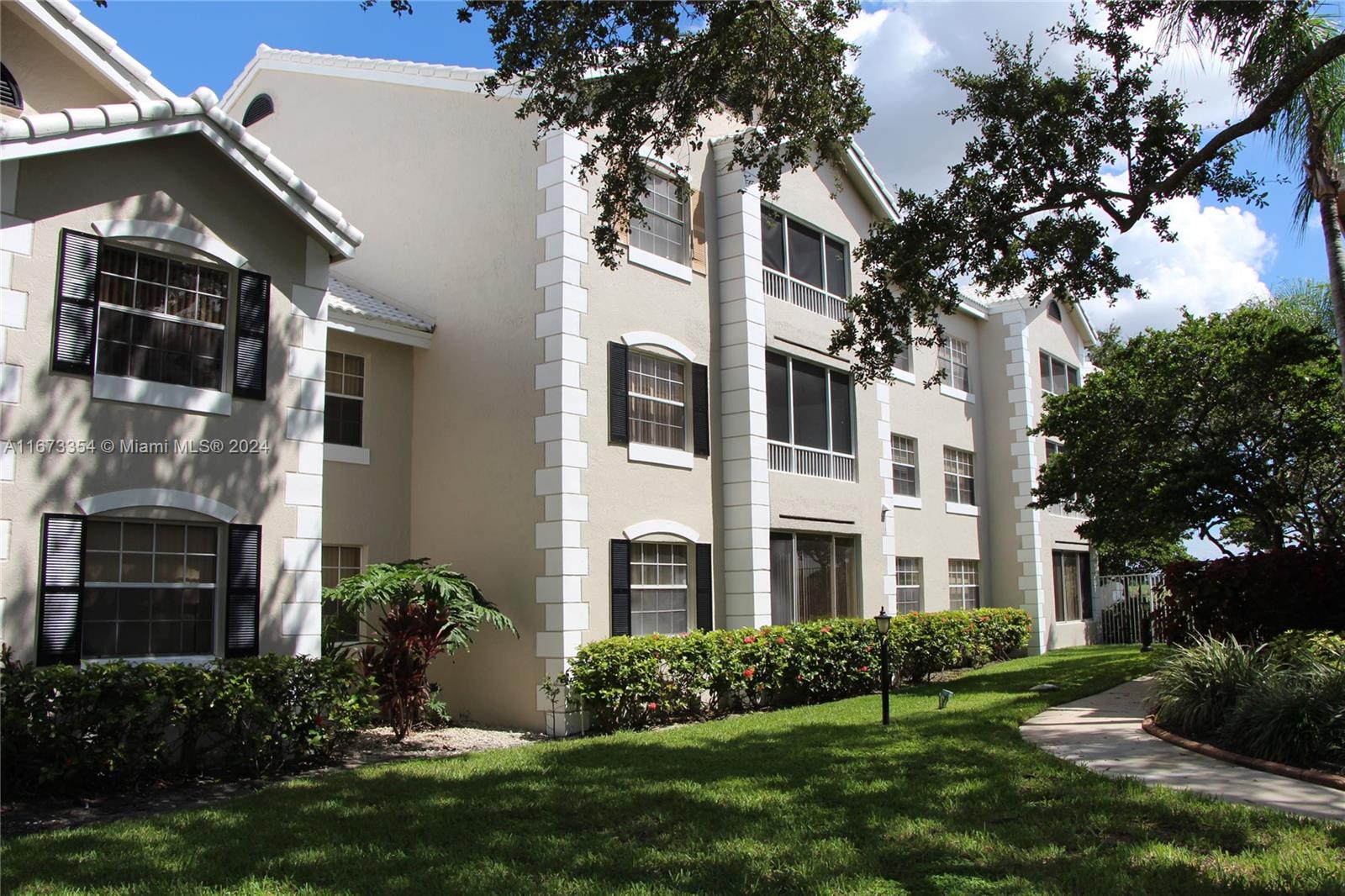 a view of a building with a yard