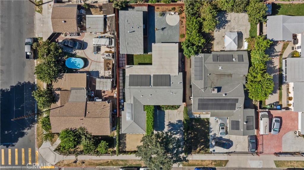 an aerial view of houses with outdoor space