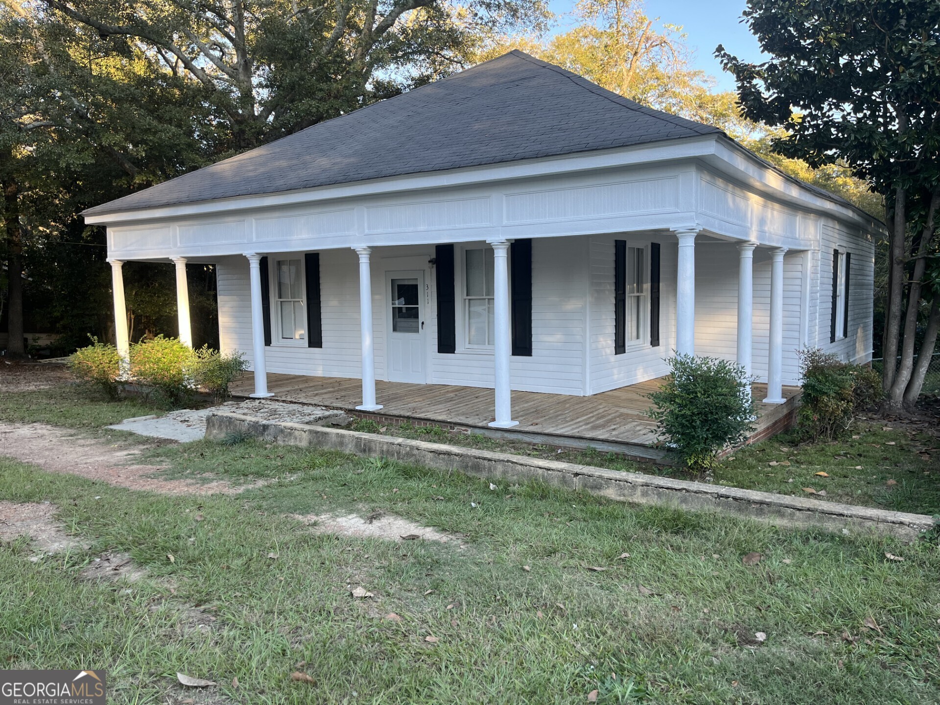 front view of a house with a yard