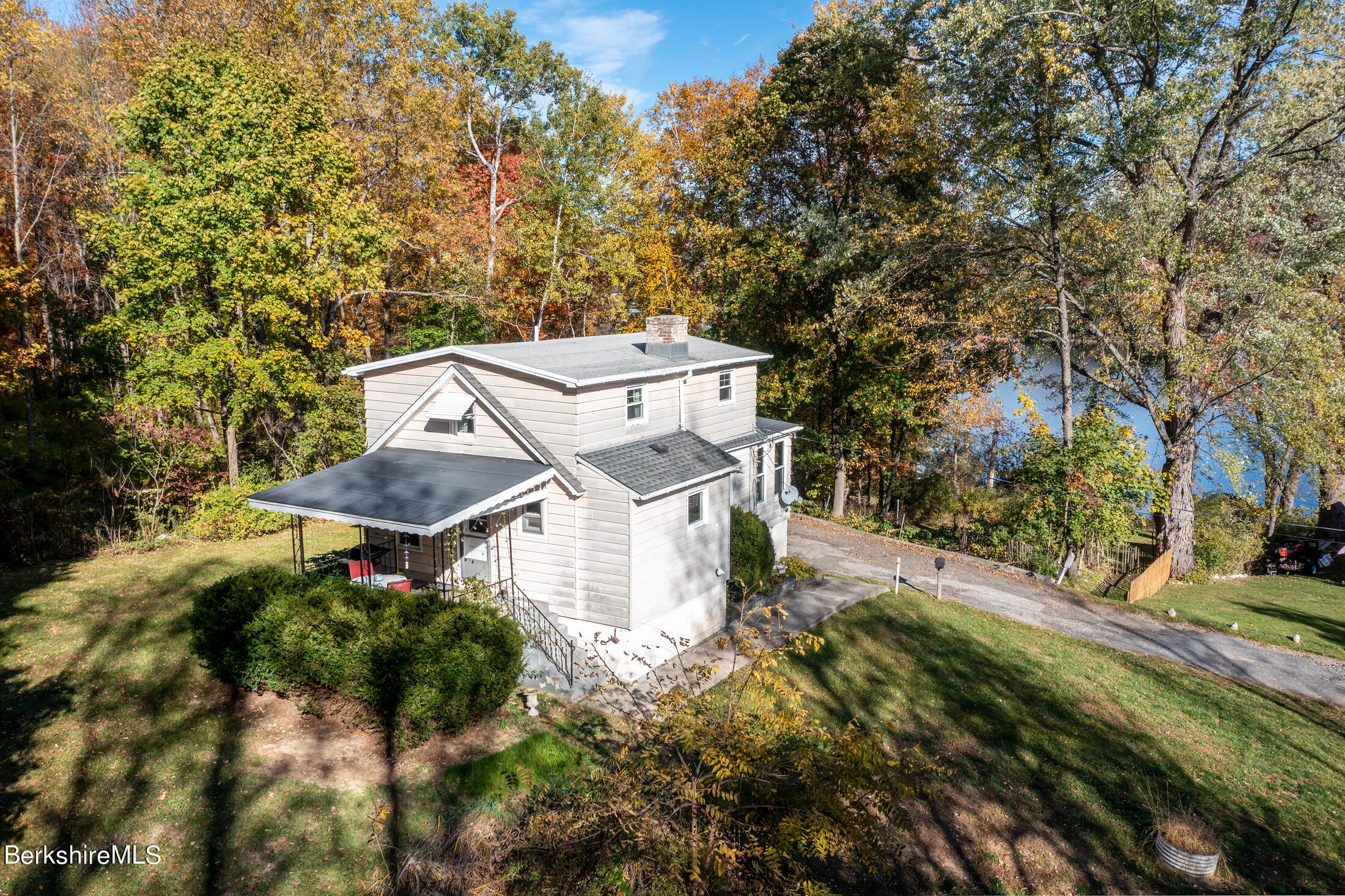 an aerial view of a house with a yard