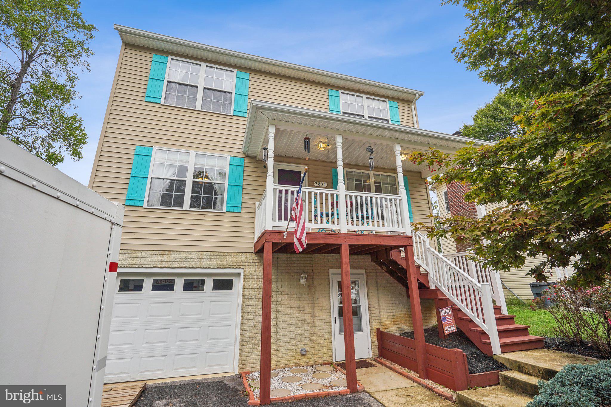 a view of a house with a yard and balcony