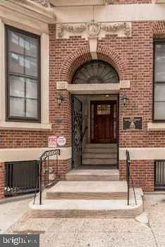 a view of front door of house with stairs