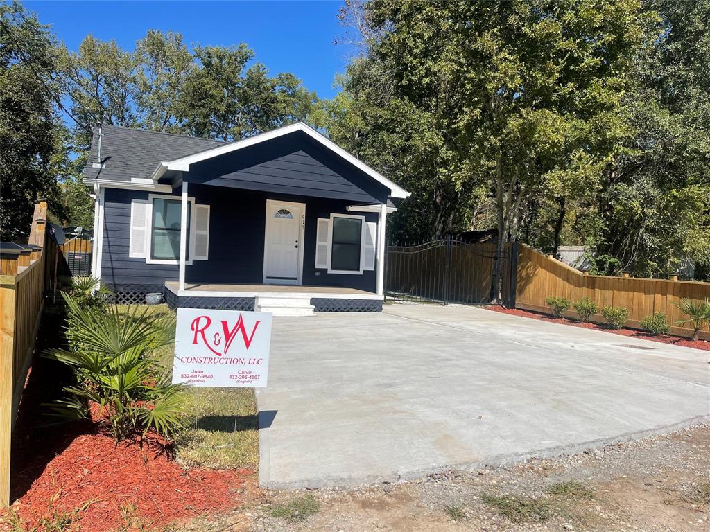 a front view of a house with sign board