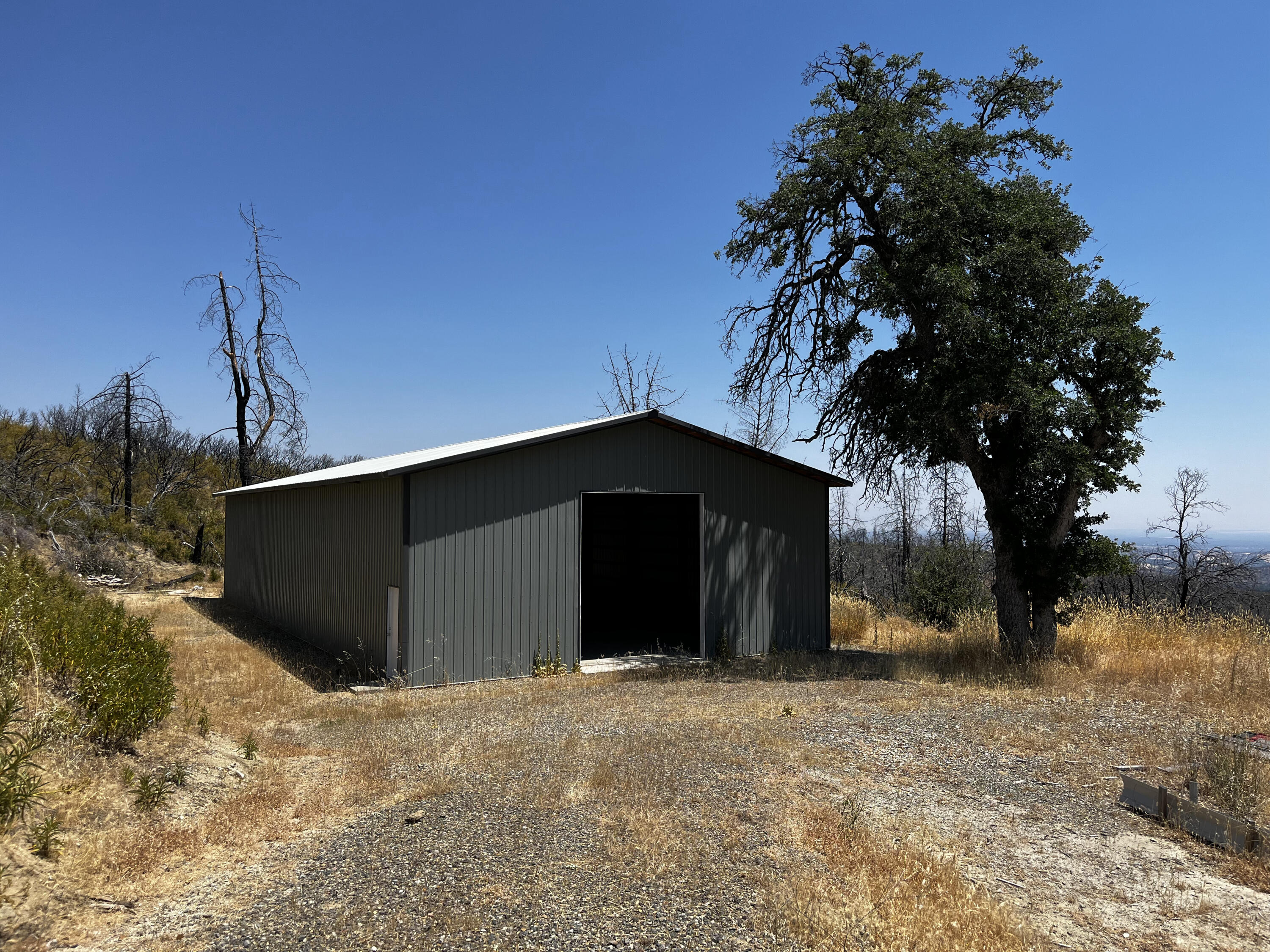 a view of a house with a yard and garage