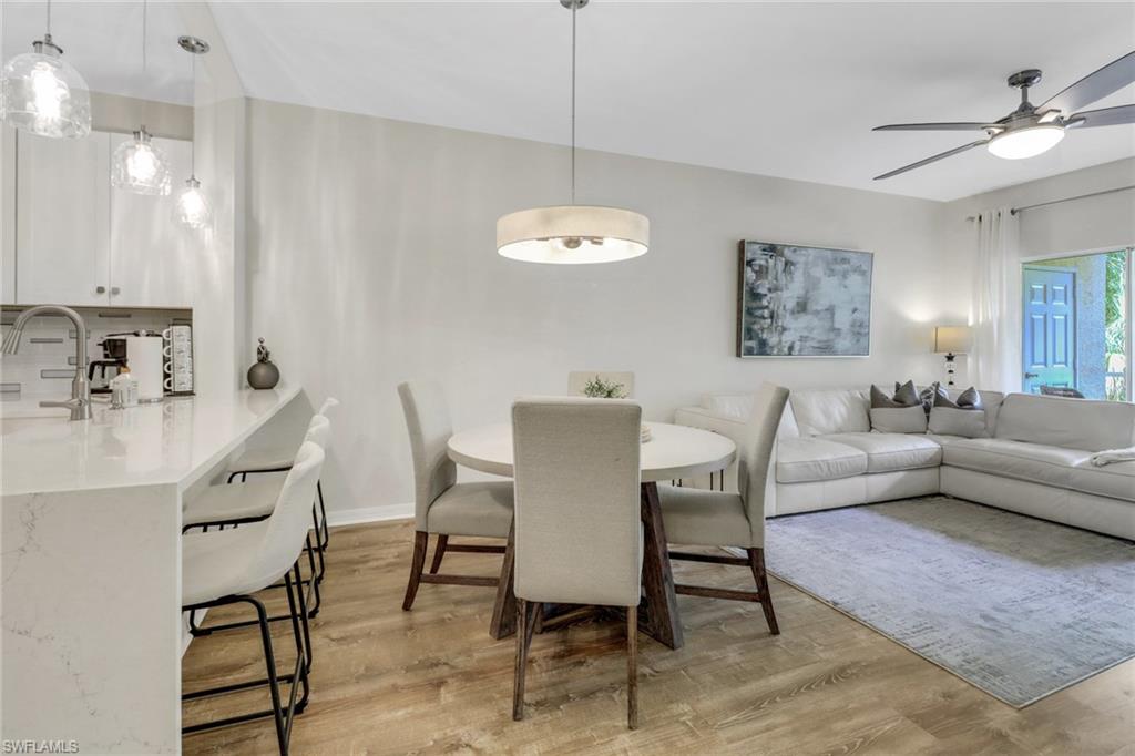 Dining room with light wood-type flooring and ceiling fan