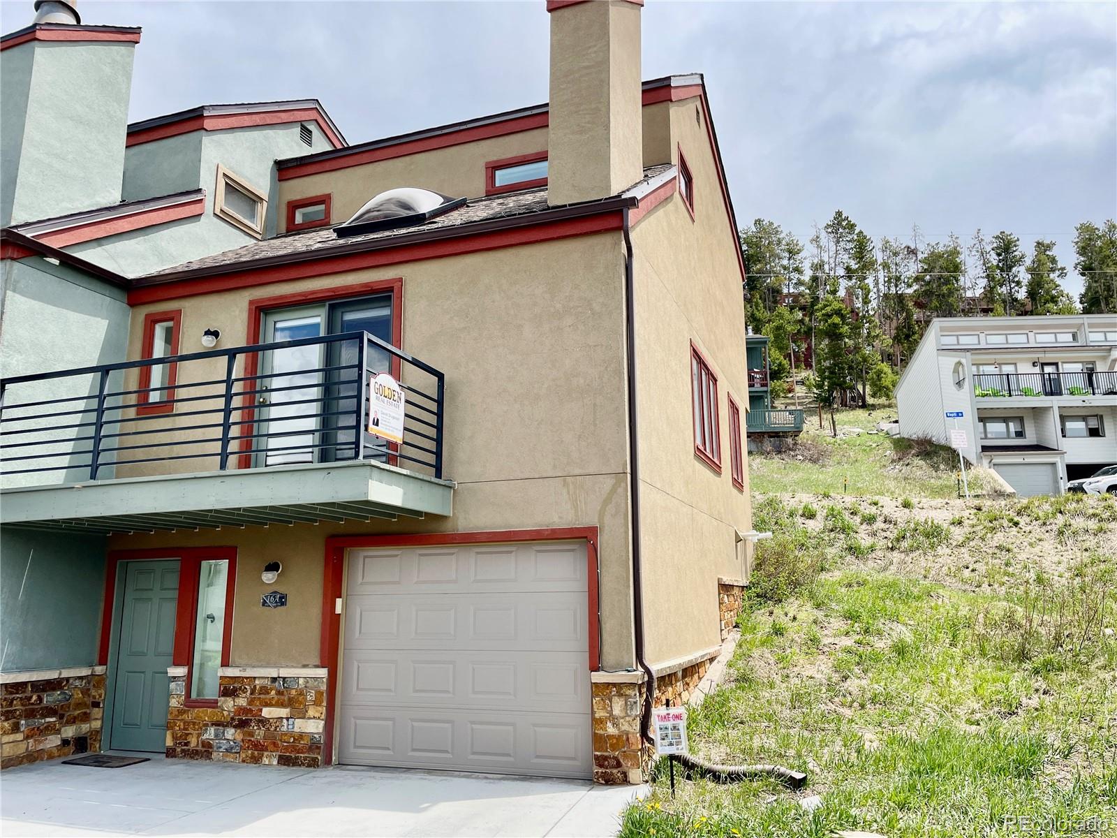 a front view of a house with parking