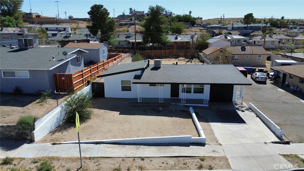 an aerial view of a house with a garden