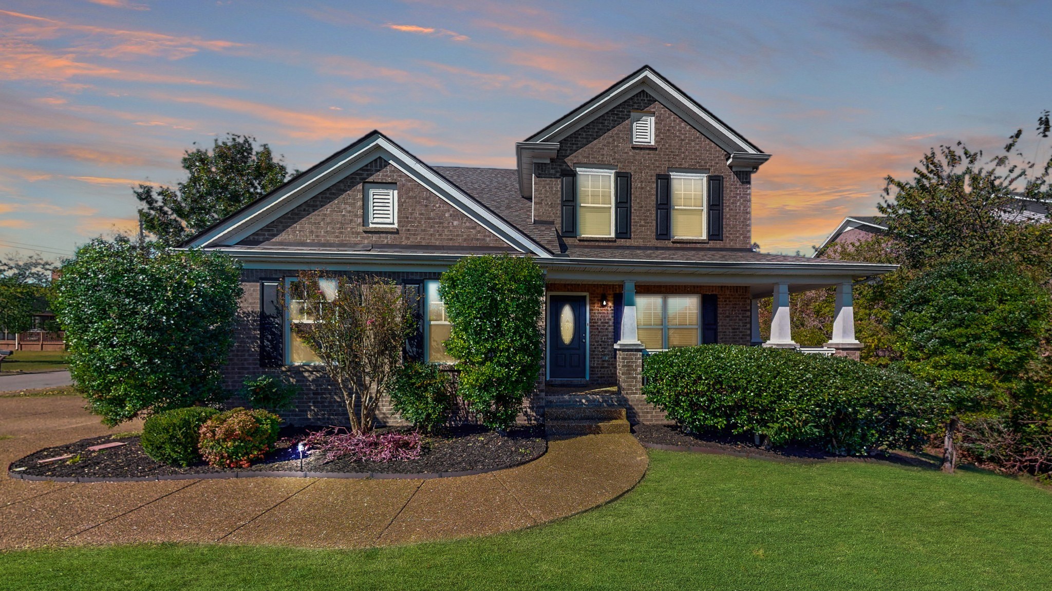 a front view of a house with garden