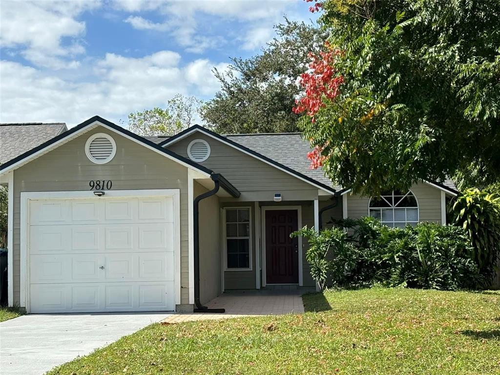 a house with a tree in front of it