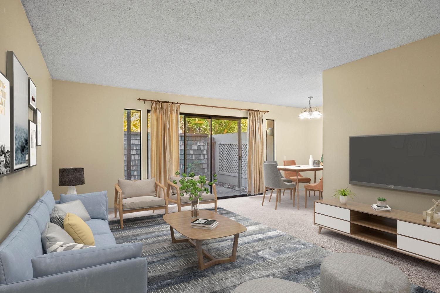 a living room with furniture and a flat screen tv