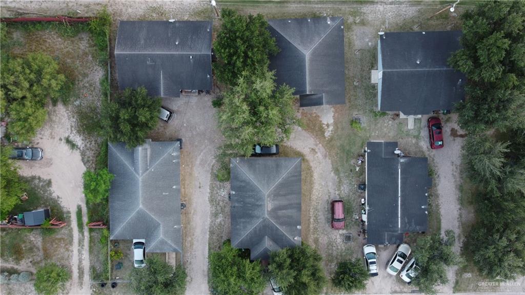 an aerial view of a house with outdoor space