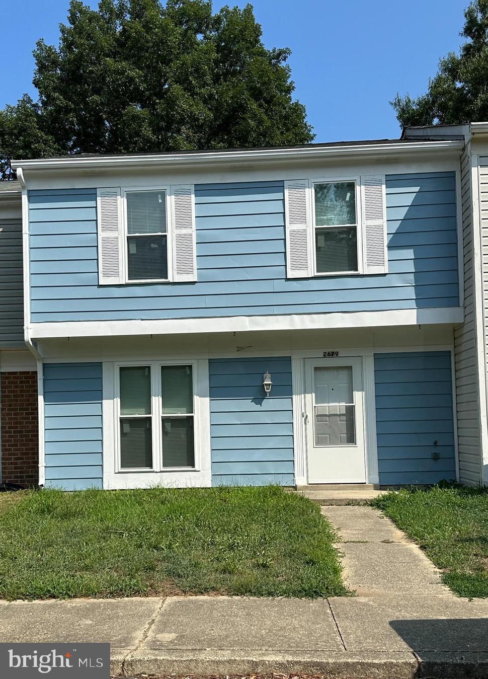 a view of a house that has window and a door