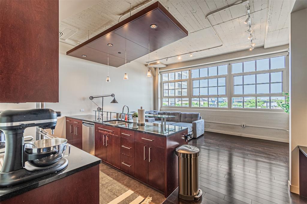 a kitchen with sink and window